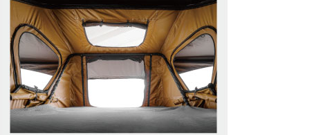 Rooftop tent interior with memory-foam mattress and windows