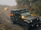 Rooftop tent mounted on a Jeep during a mountain overland trip